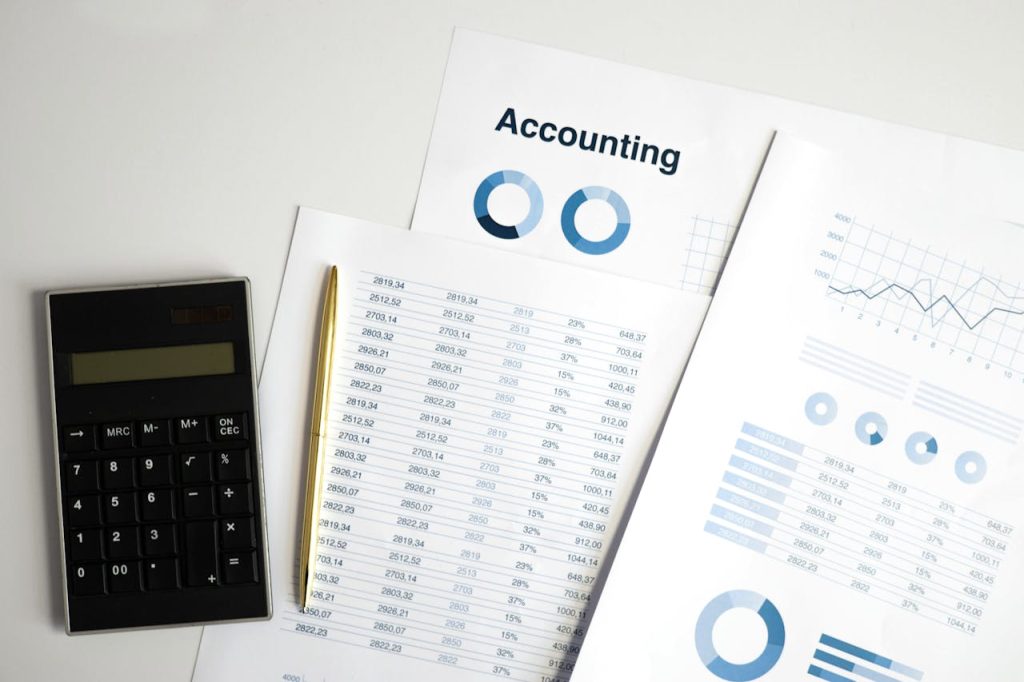 pexels photo 6779714 Calculator and accounting documents with charts on a workspace.